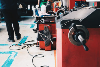 Low section of man standing in garage