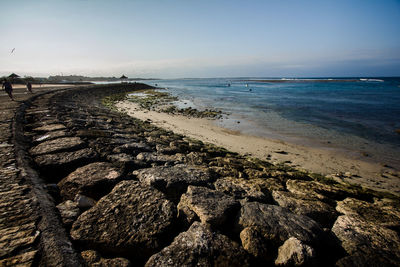 Scenic view of beach against clear sky