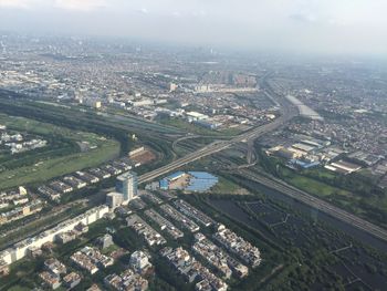 High angle view of buildings in city against sky