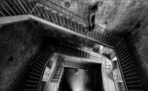 Low angle view of man on staircase