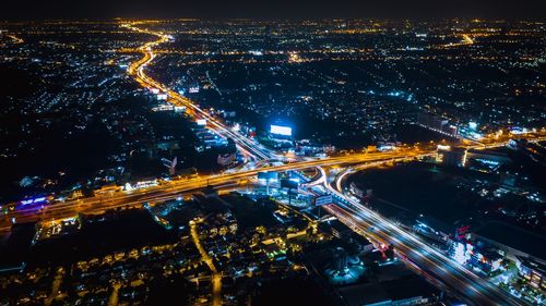 High angle view of illuminated cityscape at night