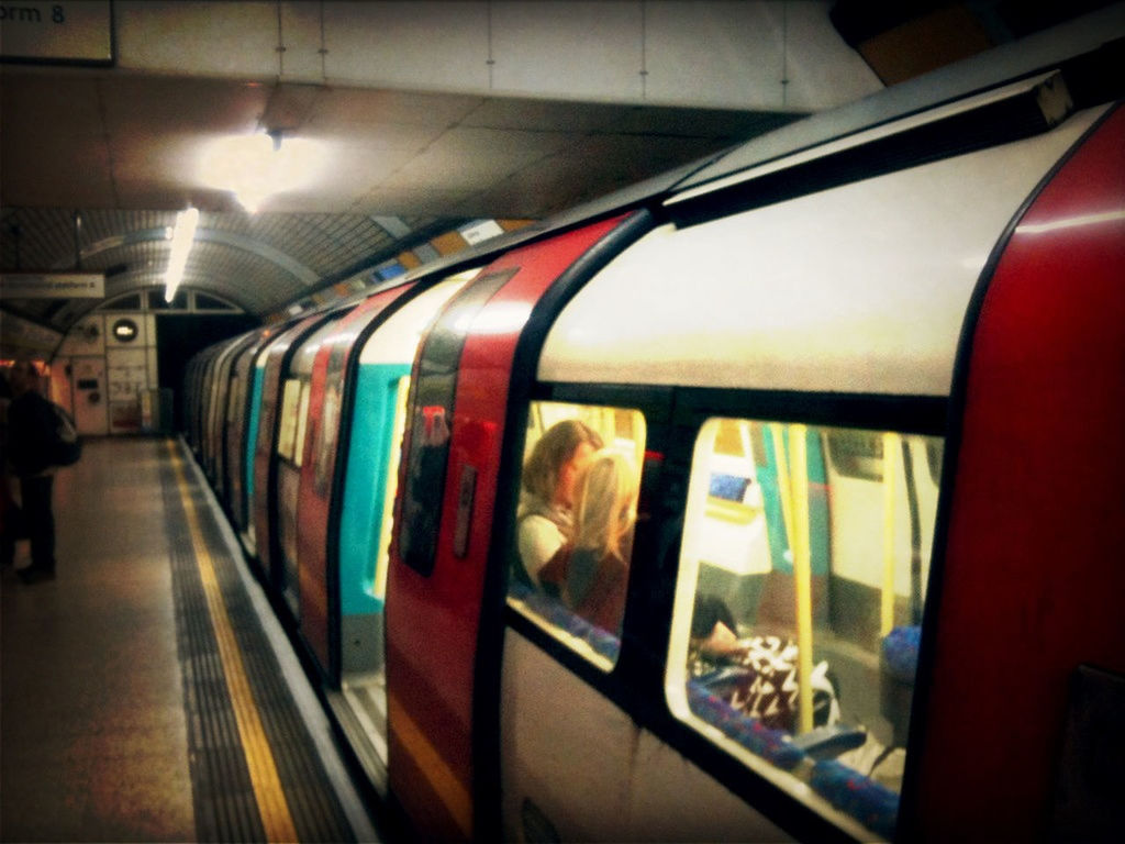 indoors, transportation, public transportation, railroad station, rail transportation, railroad station platform, train - vehicle, illuminated, mode of transport, railroad track, travel, subway station, passenger train, train, subway train, passenger, incidental people, subway, public transport