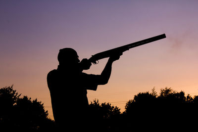 Silhouette of man against sky during sunset