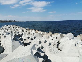 Scenic view of sea shore against sky