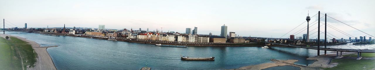 Panoramic view of bridge over river against sky