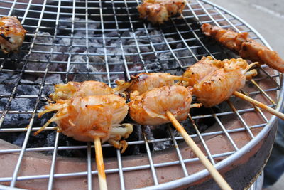 High angle view of meat on barbecue grill