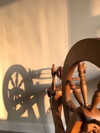 Close-up of wheel against sky during sunset