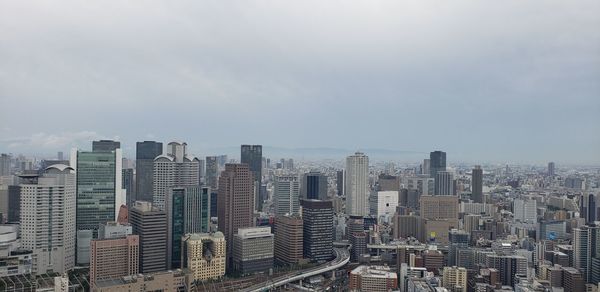 Modern buildings in city against sky