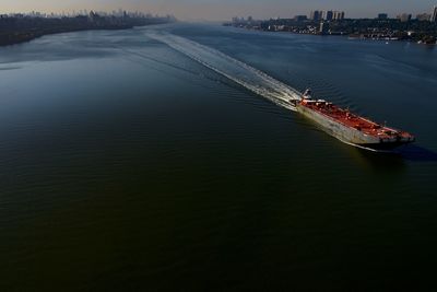 Barge in hudson river against sky