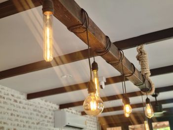 Low angle view of illuminated light bulb