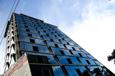 Low angle view of modern building against sky