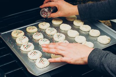 High angle view of hand holding cookies