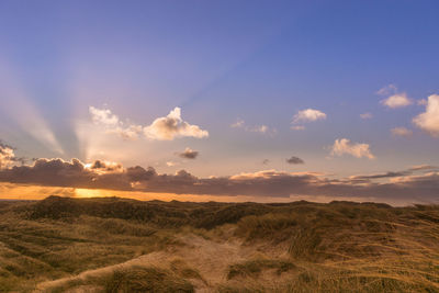 Landscape against sky during sunset