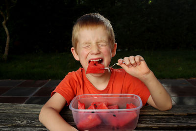 Portrait of cute girl eating food