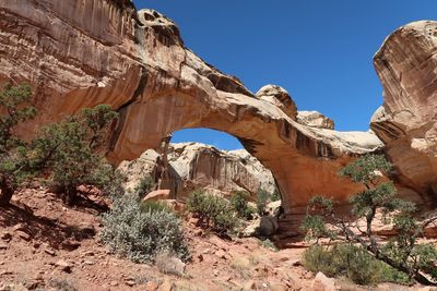 Low angle landscape of a natural stone bridge in utah