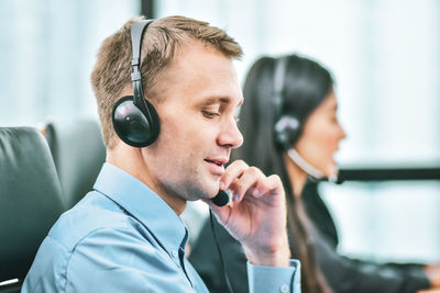 Customer service representative wearing hands-free device