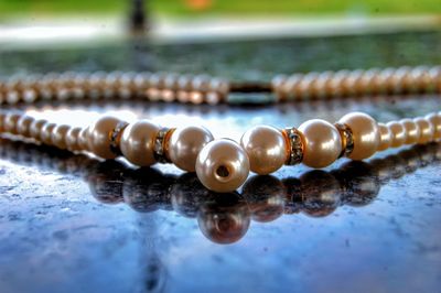 Close-up of necklace on table