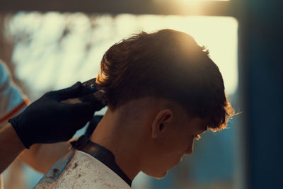 Young boy at hairdresser