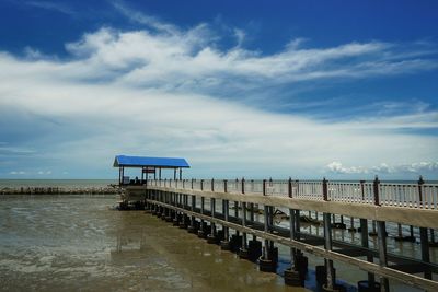 Pier over sea against sky