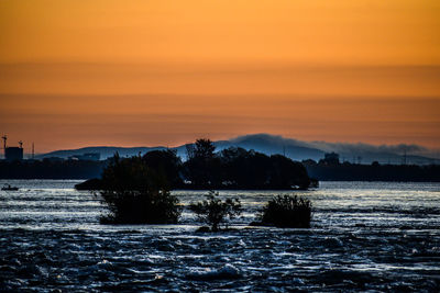 Scenic view of sea against sky during sunset