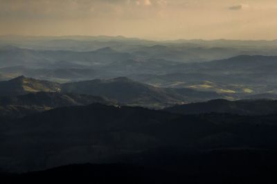 Scenic view of mountains at sunset