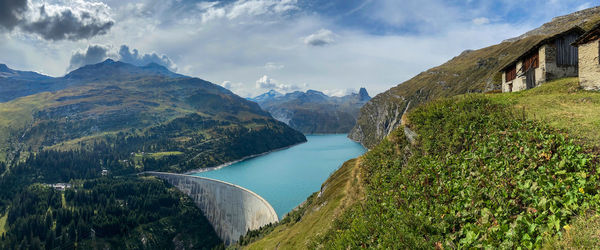 Panoramic view of river amidst mountains against sky