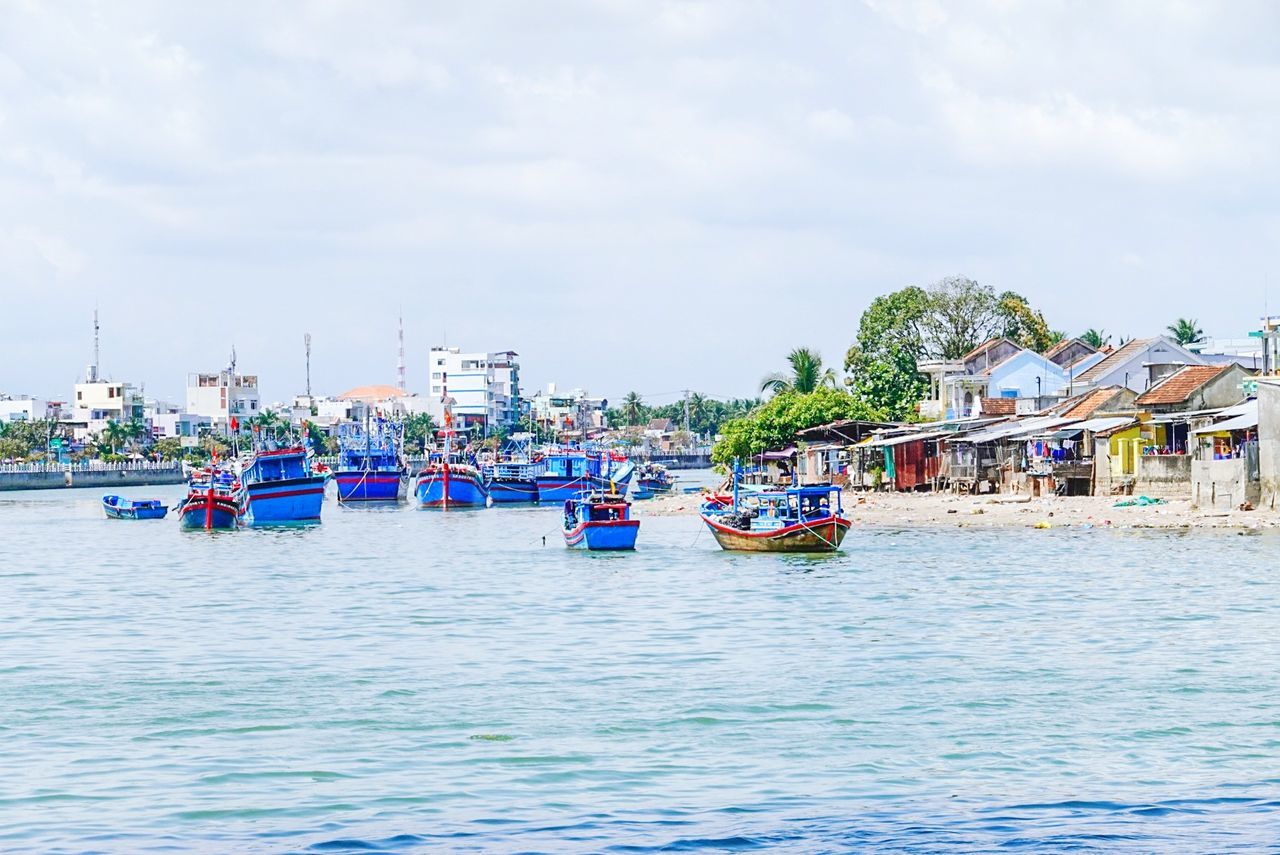 water, nautical vessel, waterfront, sky, mode of transportation, transportation, cloud - sky, built structure, architecture, day, nature, building exterior, sea, no people, travel, outdoors, city, plant, passenger craft