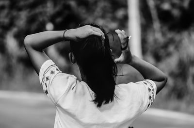 Rear view of woman walking outdoors