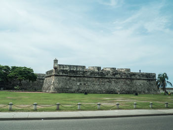 View of historical building against cloudy sky