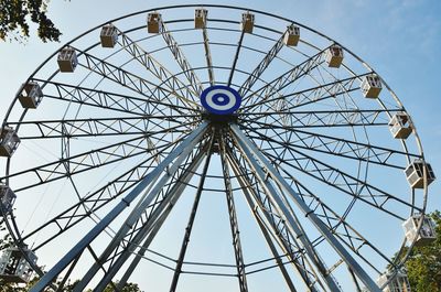 Low angle view of ferris wheel against sky