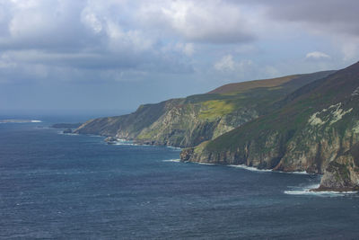 Scenic view of sea against cloudy sky