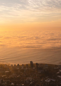 High angle view of buildings against sky during sunset