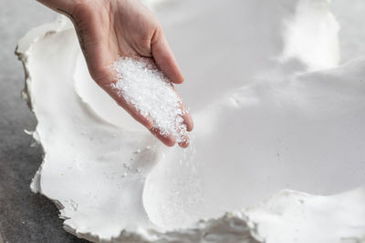 Frit glass being poured into plaster mold