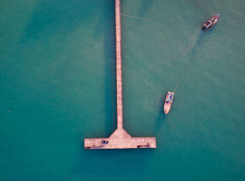 Directly above shot of boats and pier on sea