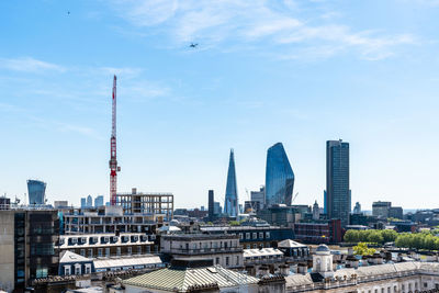 Modern buildings in city against sky