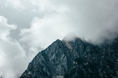 Scenic view of snow covered mountains against sky