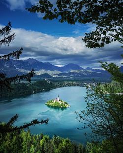 Scenic view of lake and mountains against sky