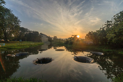 Scenic view of lake against sky during sunset