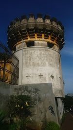 Low angle view of built structure against blue sky