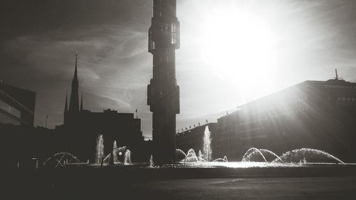 Sun shining over cathedral in city