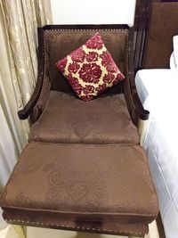 High angle view of chair on bed at home