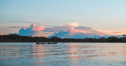 Scenic view of lake against sky during sunset