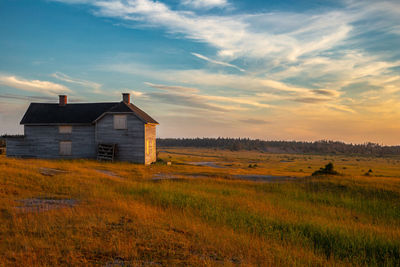 Scenic view of field against sky during sunset