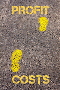 High angle view of yellow arrow sign on road