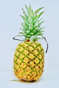 Close-up of fruit against white background