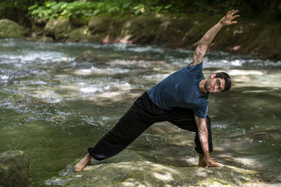 Full length of man standing in lake