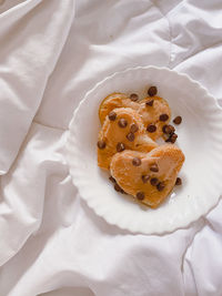 High angle view of dessert served on bed