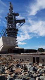 Low angle view of traditional windmill against sky