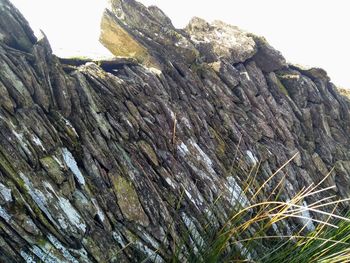 Low angle view of rock against sky