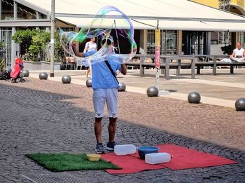 Rear view of man skateboarding